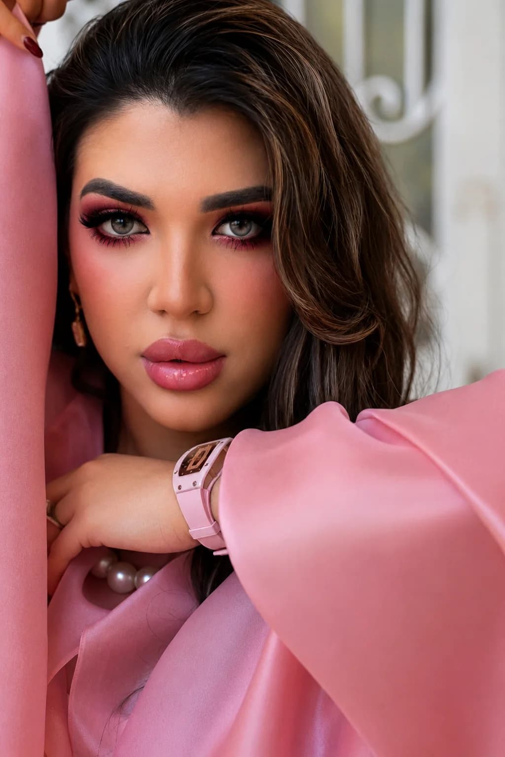 Close-up portrait of Almas Anfar Kathuria in pink