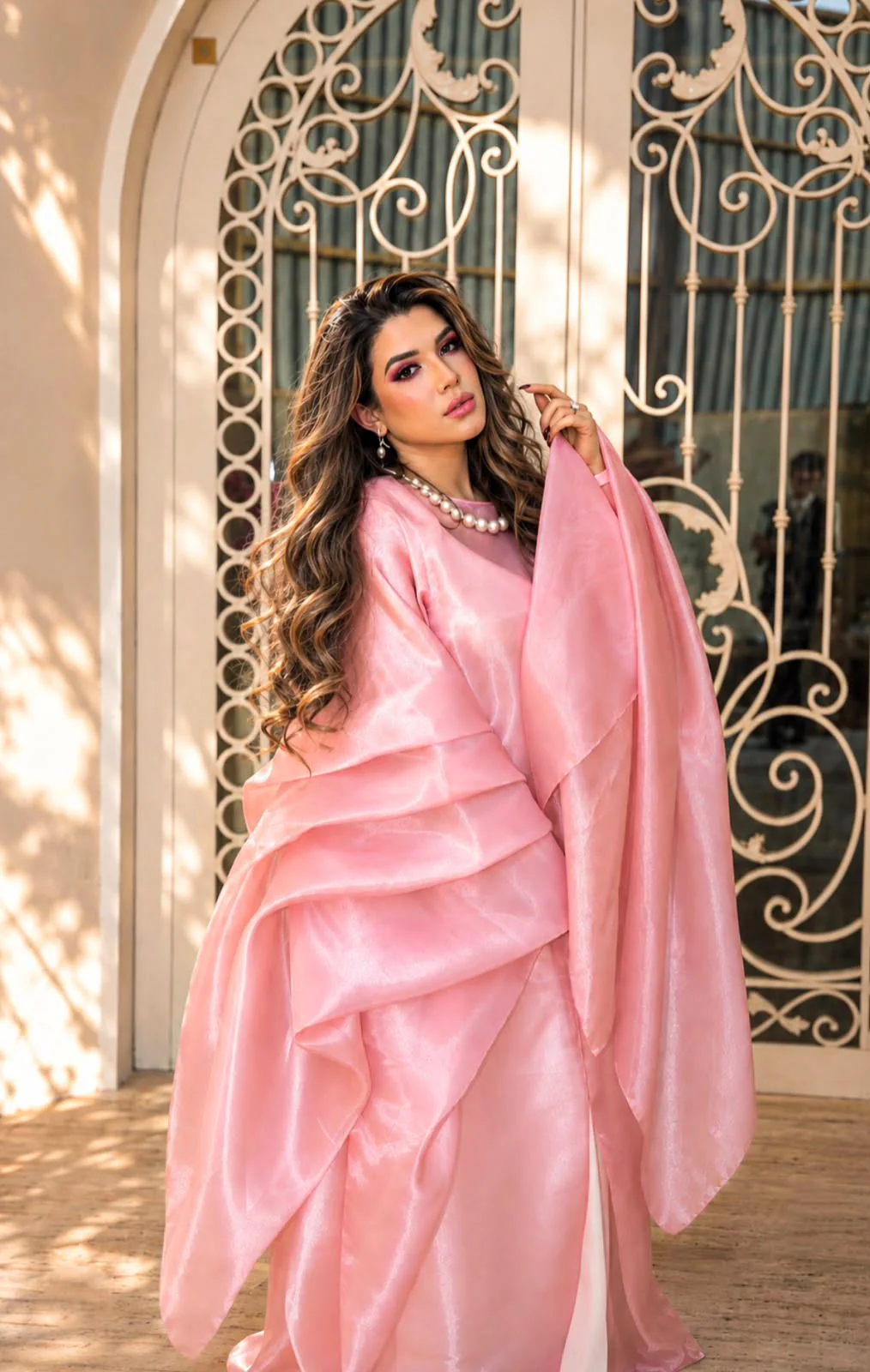 Almas Anfar Kathuria in a flowing pink portrait
