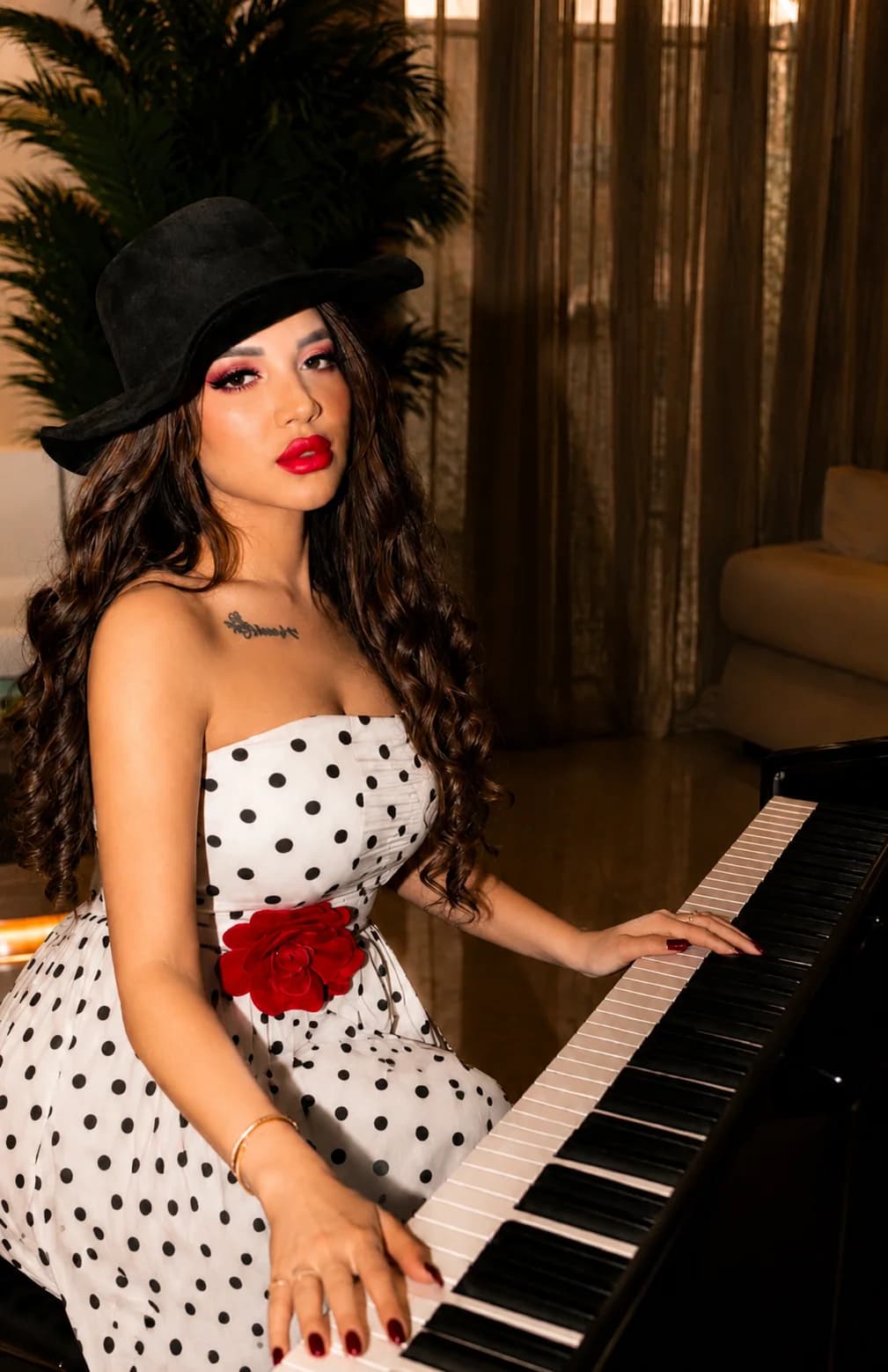 Close editorial portrait of Almas Anfar Kathuria at a piano