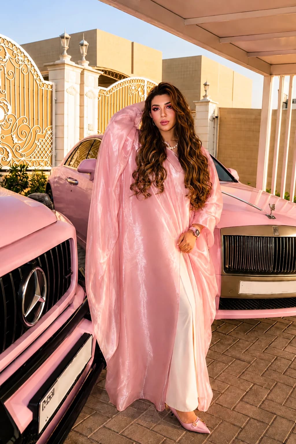 Almas Anfar Kathuria photographed beside a classic car